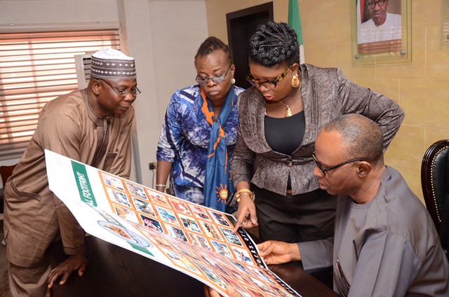 Governor Mimiko looking at Past Rise Networks Event Photo Collage